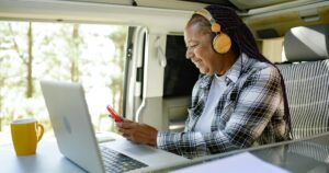 woman uses internet on phone in rv