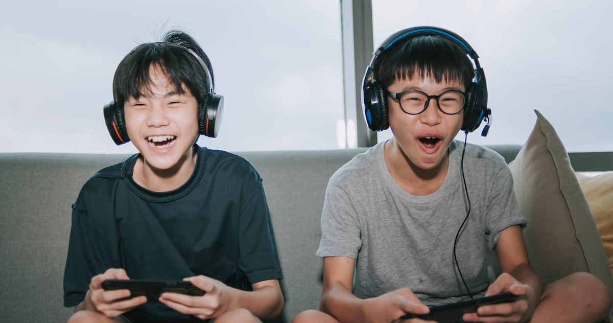 kids playing video games in their living room
